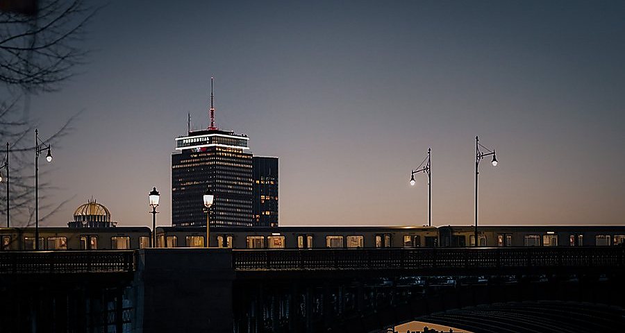 A train crossing above Boston at blue hour